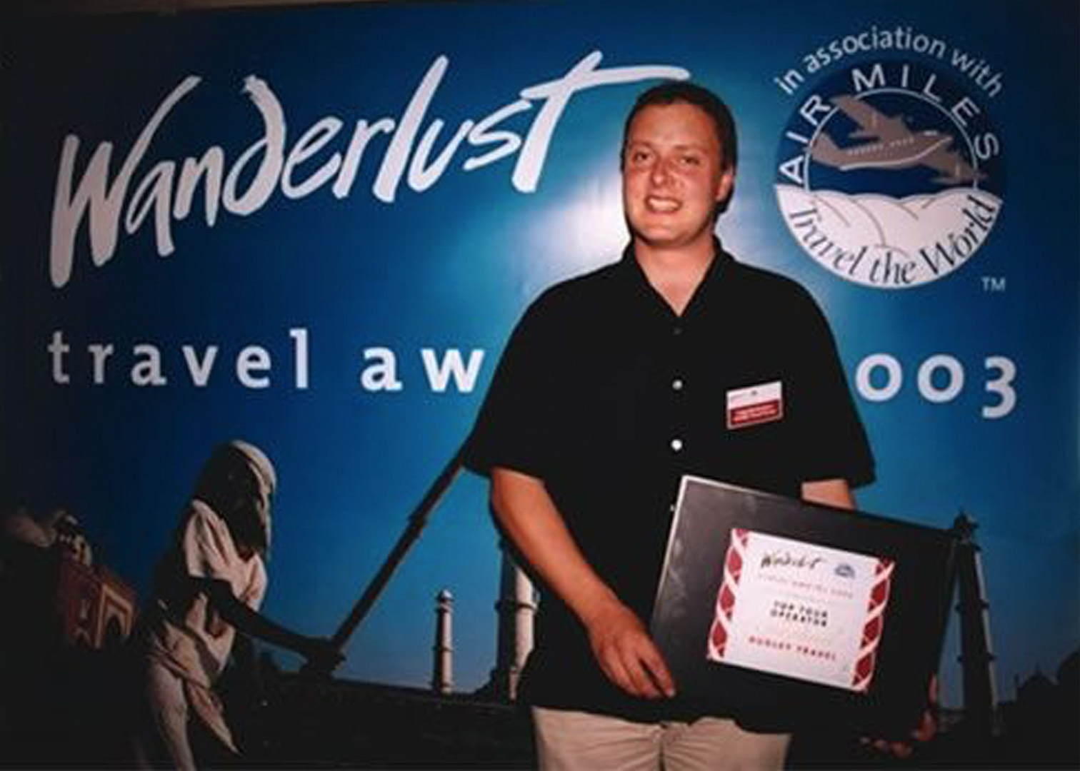 Craig accepting the 2003 Wanderlust award